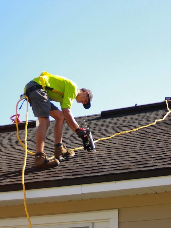 Roofing contractor at work