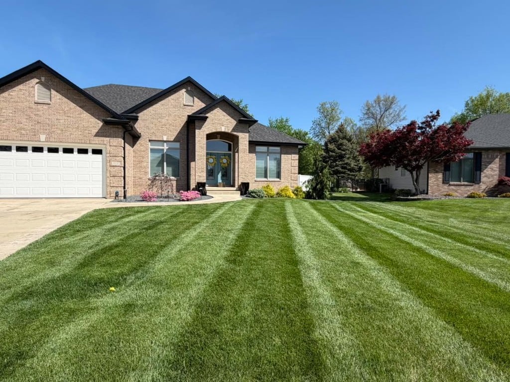 Before enhancement: original job-site lawn care photo from social media